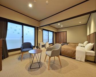 Yumoto Shirogane Onsen Hotel - Biei - Спальня