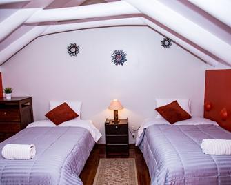 Kori Gems Inn - Cusco - Schlafzimmer
