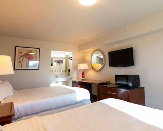 Magnuson Extended Stay and Suites Airport Hotel - Irving - Habitación