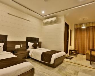 Hotel Kamran Palace - Ahmedabad - Makuuhuone