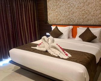 Purple Hotels & Resorts - Tiruppur - Schlafzimmer