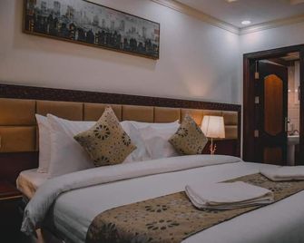 Al Muhajer Serviced Apartments in Al Salamah District - Cidde - Yatak Odası