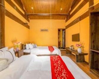 Shu He Rosemary Inn - Lijiang - Schlafzimmer