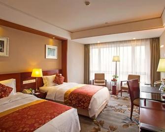 Guangye Jinjiang Hotel - צ'ינגדאו - חדר שינה