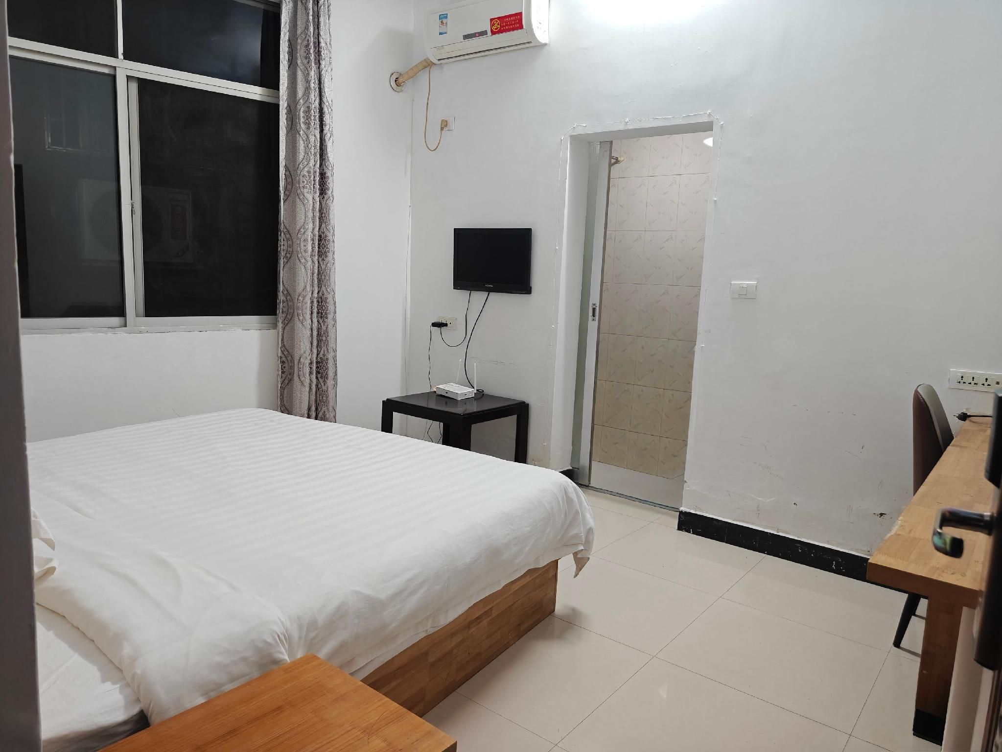 Weather Hotel (Guilin North Railway Station) - גילין - חדר שינה