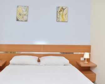 Homestay 82 Syariah Palembang - Palembang - Camera da letto