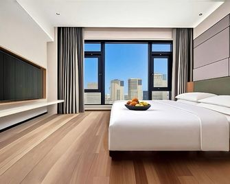 Platinum Cloud Hotel (Wanda Plaza Branch) - Jinhua - Schlafzimmer