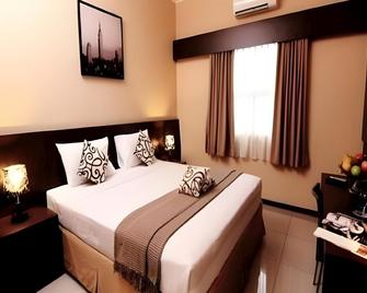 Pondok Keluarga Osamaliki - Salatiga - Camera da letto