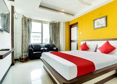OYO Flagship 810217 Hotel Vijayalakshmi - Tiruppur - Schlafzimmer