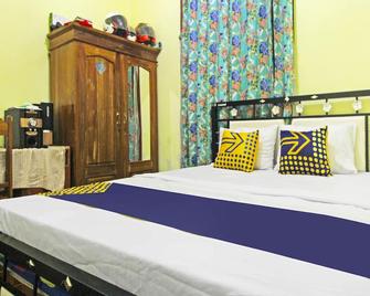 Hotel O Desa Wisata Nangelasarinearpasir Tulang - Tasikmalaya - Bedroom