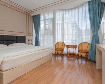 Kunming coated sugar Guesthouse - Kunming - Bedroom