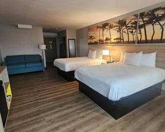 Days Inn & Suites by Wyndham Artesia - Artesia - Спальня