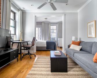 Modern West Village 1BR w/ Balcony & In-Unit W/D, by Blueground - New York - Living room