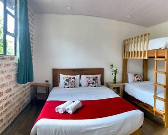 Margarit Boutique Hotel - Mindo - Schlafzimmer