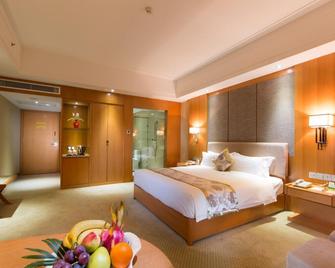 The Grand Plaza Hotel - Ji’an - Schlafzimmer