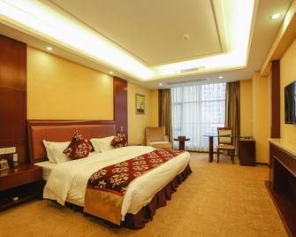 Xinghu Yipin Resort Hotel (Zhaoqing Railway Station) - Zhaoqing - Bedroom