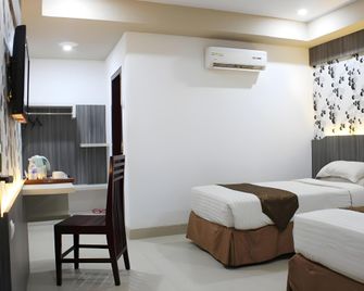 Grand Hotel Jambi - Jambi - Slaapkamer