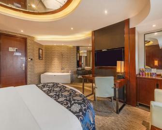 Wanbo International Hotel - Ji'an - Bedroom