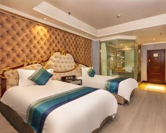 Yijia City Hotel (Mianyang Tieniu Square) - Mianyang - Camera da letto