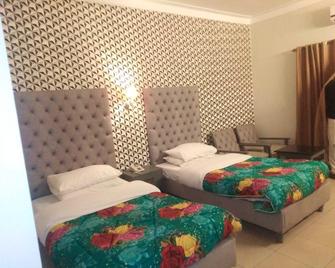 Sangam Hotel Muzaffarabad - Muzaffarabad - Camera da letto