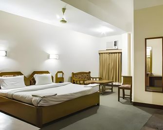 Hotel Hornbill - גוואטי - חדר שינה