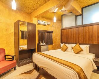 كورج جنجل كامب باك ووتر ريزورت - ماديخيري - غرفة نوم