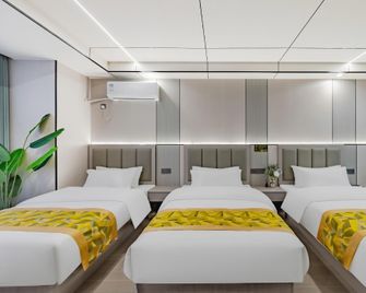 Jixinya Hotel (Shangrao Economic Development Zone Optics City Branch) - Shangrao - Schlafzimmer