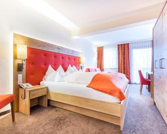 Hotel Alpenland - טמשווג - חדר שינה