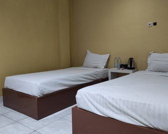 Hotel O Wisma Syariah Lahundape - Kendari - Bedroom