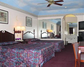 Scottish Inns And Suites - Humble - Bedroom