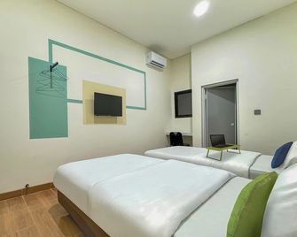 Urbanview Hotel Aloevera Pontianak by RedDoorz - Pontianak