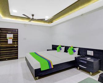 Treebo Baby Pearl - Amrāvati - Bedroom