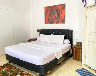 RedDoorz Syariah Near Balai Meuseuraya Aceh - باندا اسه - غرفة نوم