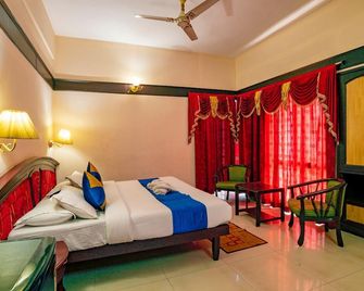 Munnar Inn - מונאר - חדר שינה