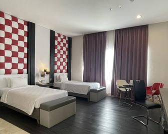 Swiss-Belcourt Makassar - מקאסר - חדר שינה