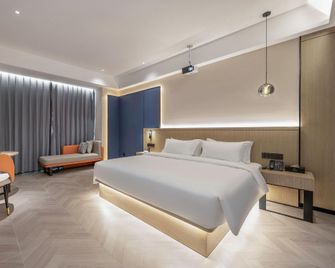 Tuker Digital Hotel (Zhangzhou Minnan Water Town Fulongcheng Branch) - Zhangzhou - Schlafzimmer