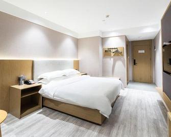 Home Inn Huaxuan Collection Hotel (Lu'an Guangcai Market) - Lu’an - Bedroom