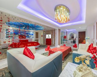Real Madrid Holiday Island Style Hotel (Haikou Qilou Old Street) - Haikou - Habitación