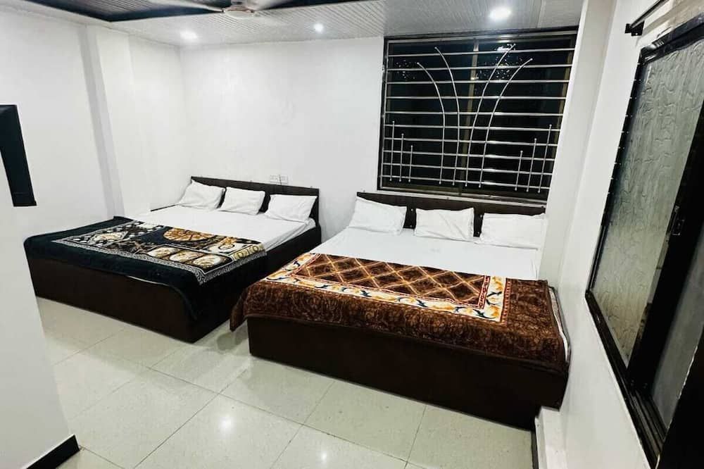 Hotel Narmada Residency - אויאיין - חדר שינה