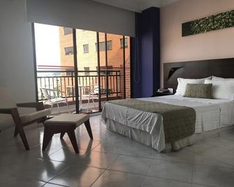 Casa Morales Hotel Internacional y Centro de Convenciones - Ibagué - Slaapkamer