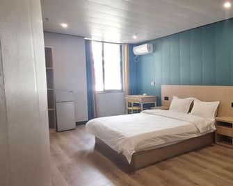 Shicheng Selected Homestay (Nanjing Jiangning Wanda) - Nanjing - Bedroom