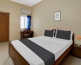 Super Hotel O Chinnamuthu Main Street - Erode - Bedroom