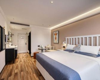 Aifeel Hotel (Zibo Liantong Road Mingqing Street Branch) - Zibo - Bedroom