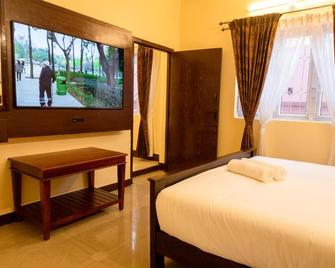 Aakash Rooms and Cottages, - Ooty - Slaapkamer