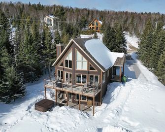Hôtel à la maison - Chalet l'Odyssée, spa et Vue - Les Éboulements - Building