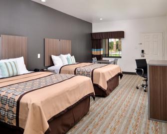 Scottish Inn & Suites - Conroe - Bedroom