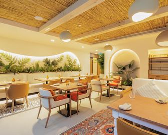 Holiday Inn Dubai Village Circle by IHG - Dubai - Restaurant