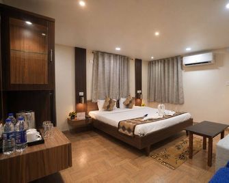 Hotel Sapphire Inn - Deoghar - Slaapkamer