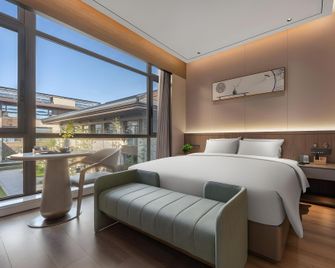 Renjoy Hotel - Yangzhou - Habitación
