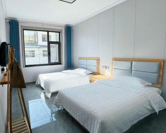 Wutai Mountain Ruiheyuan Hotel - Xinzhou - Slaapkamer